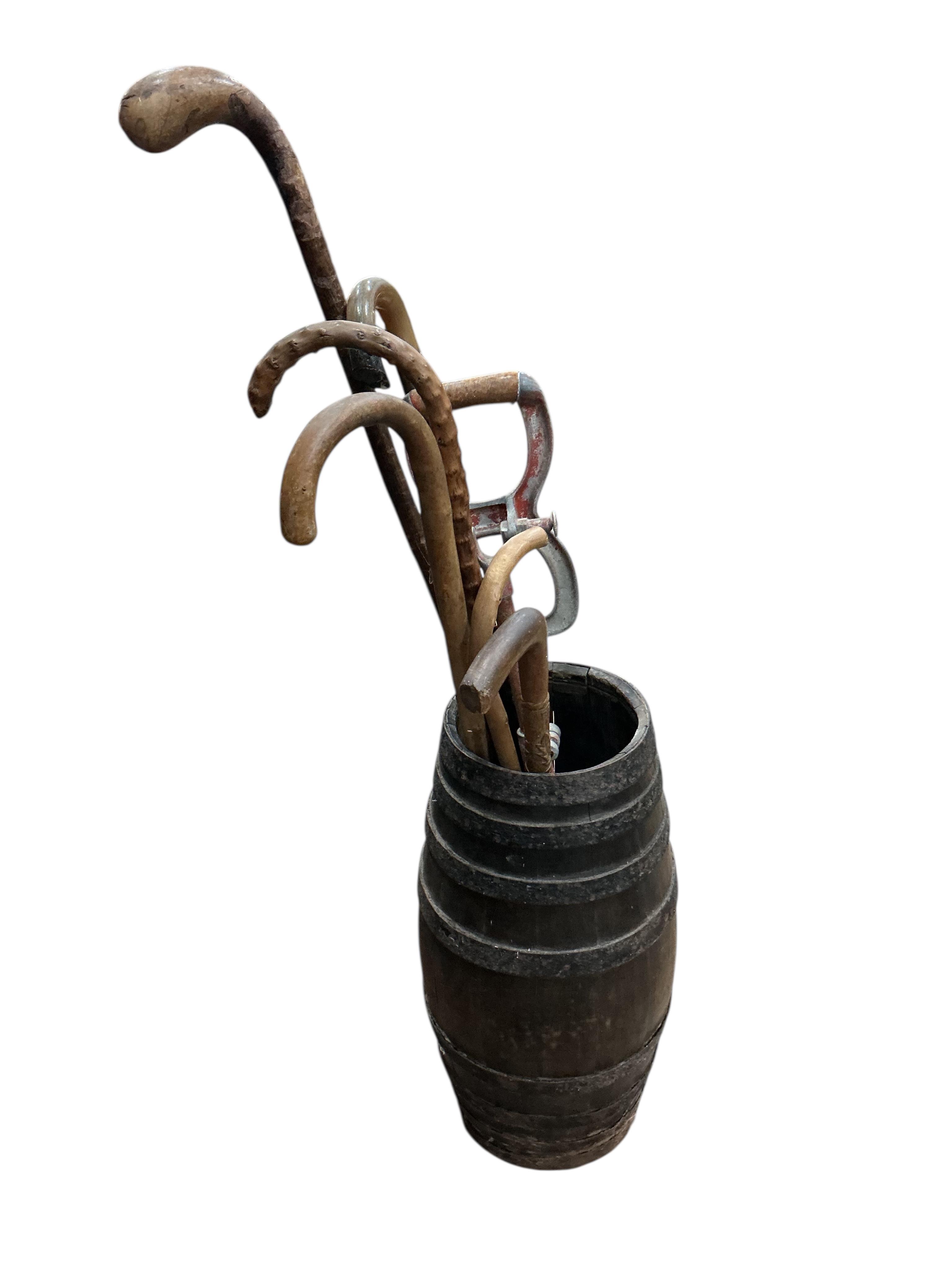 A Victorian iron bound staved stick stand, height 52cm, together with a collection of assorted sticks